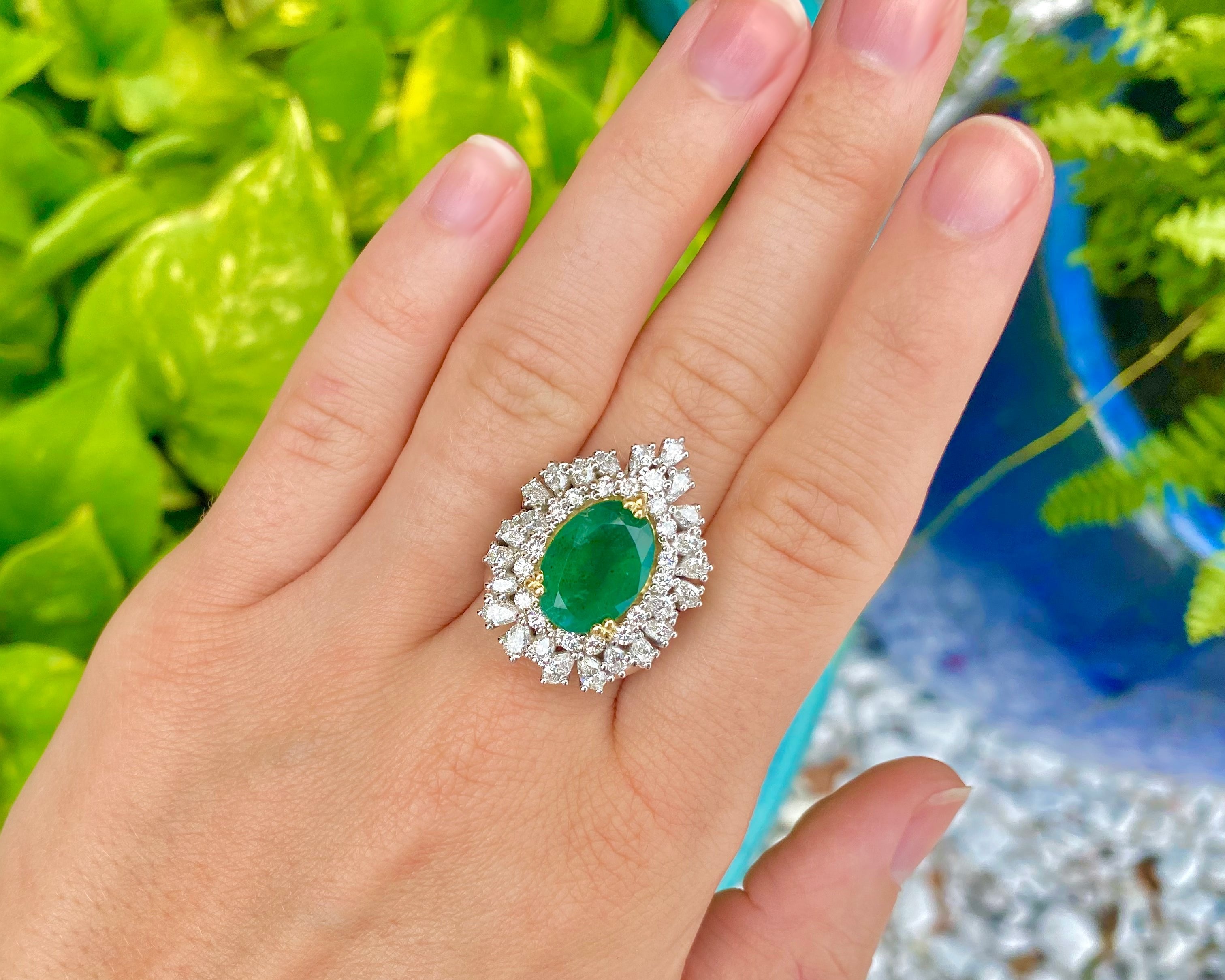 Custom handcrafted emerald engagement ring designed in Austin, Texas
